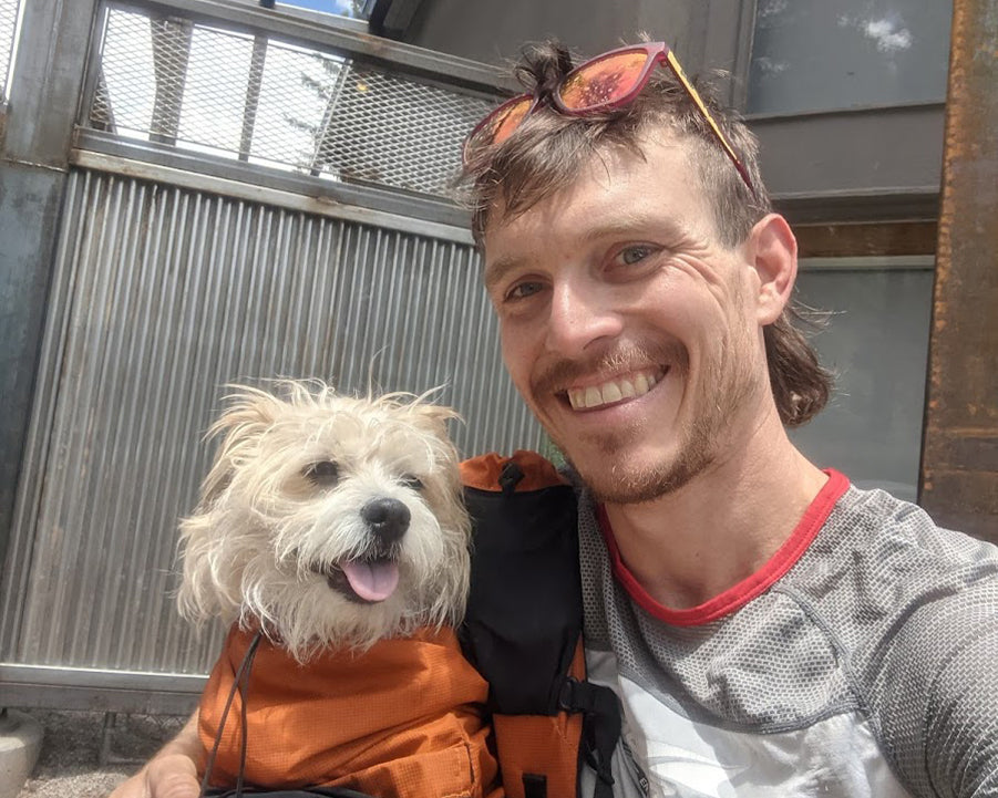 Tailwind Athlete Kyle Curtin and his dog, Tom.